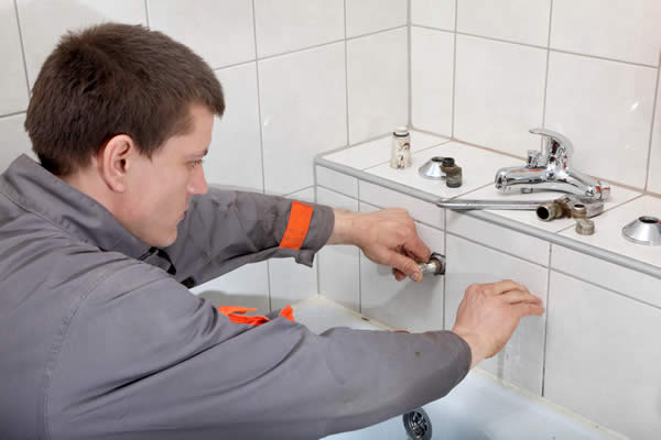 Plumber fixing Pipe